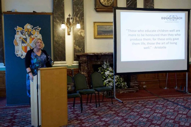 Photo of Sarah Soyei delivering a keynote speech at the launch event of the Universal Values resource
