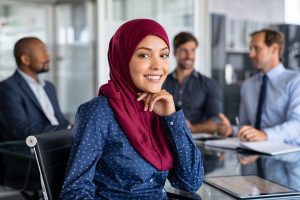 Muslim businesswoman wearing hijab in office meeting